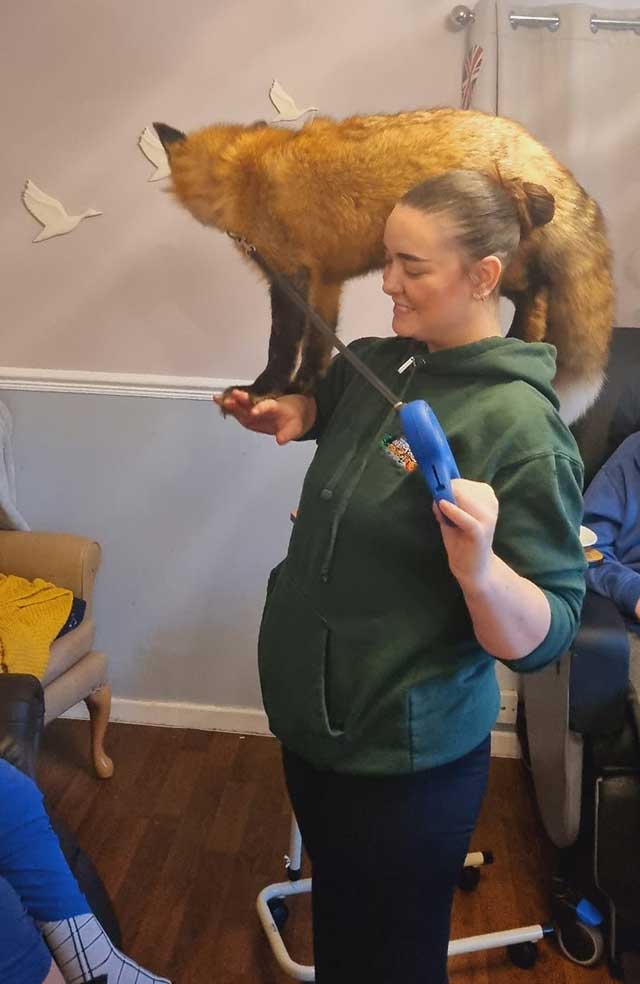 a woman with a fox