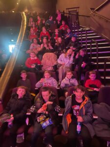 a school class sat in the theatre