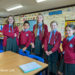 five school children stood in a classroom