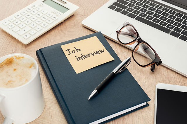 a book with note saying job interview on it