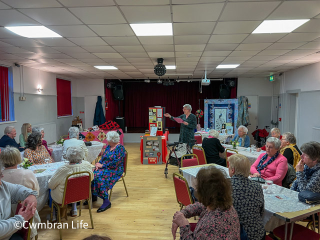 woman present to a room full of people