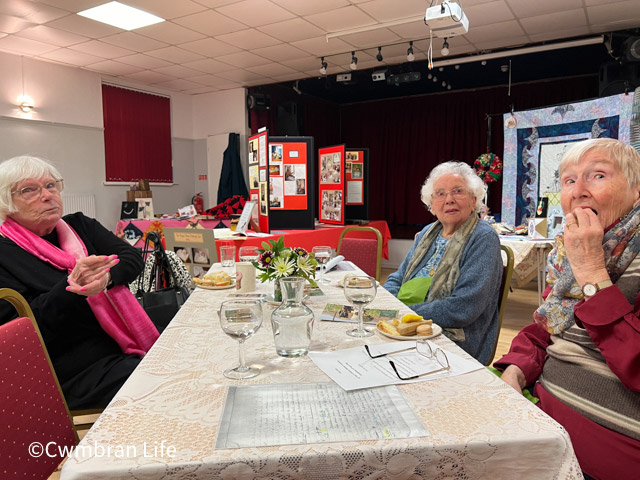 women at table in hall