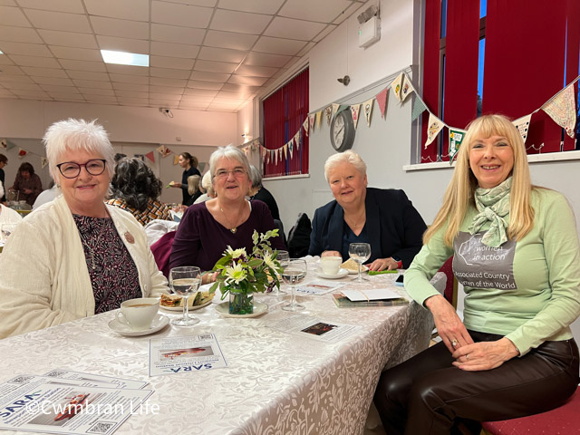 women at table in hall