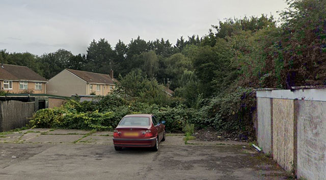This overgrown wasteland beyond these garages in Cwmbran, and behind homes at Plas Ty Coch to the right, is to be used for growing fruit and vegetables
