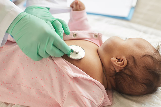 child being examined by doctor