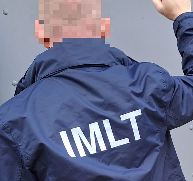 A jacket with the letter ILMT on it