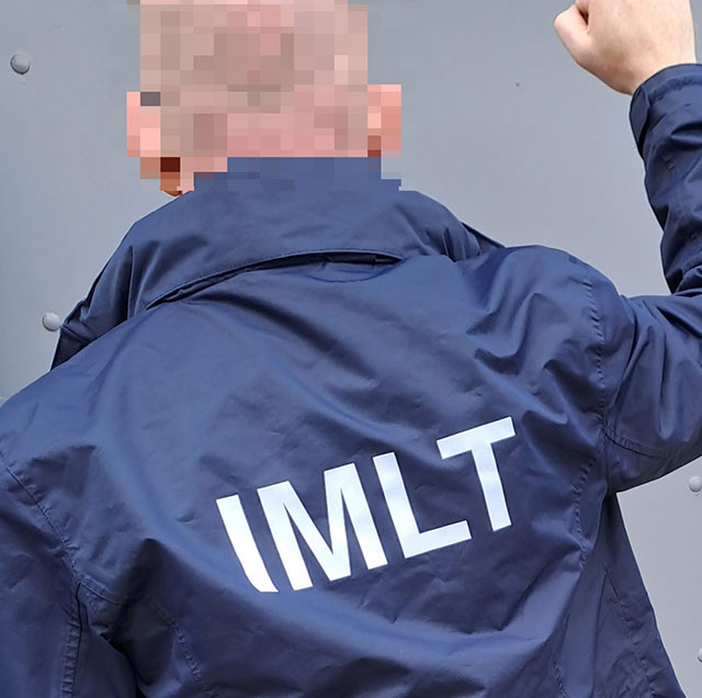 A jacket with the letter ILMT on it