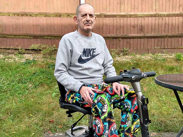 a man in a mobility scooter