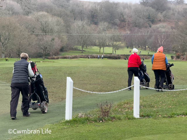 Three golfers head off for a round of golf