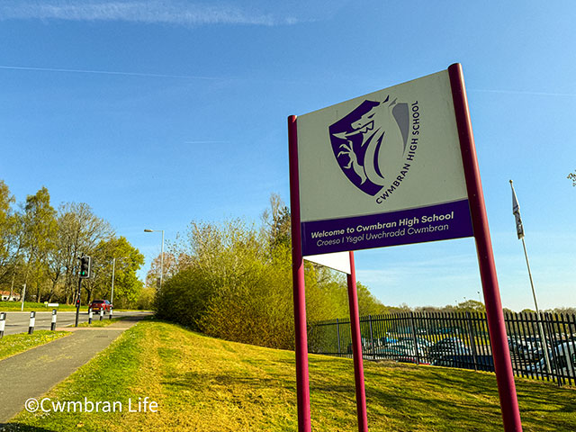 a sign for Cwmbran High School outside the entrance to the school