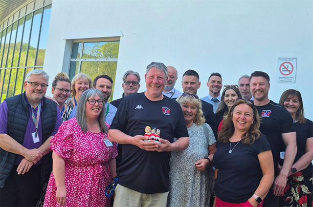 Dale Philpott, 60, with his colleagues at Abersychan School