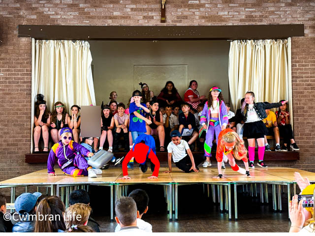 children dancing on a stage