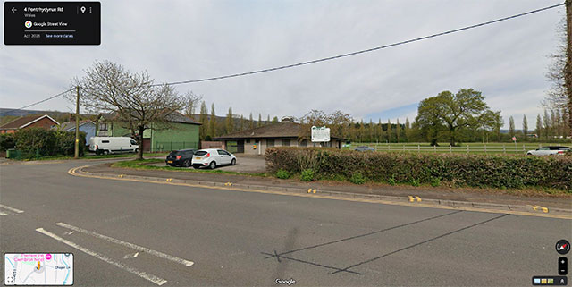 a road and entrance to a car park