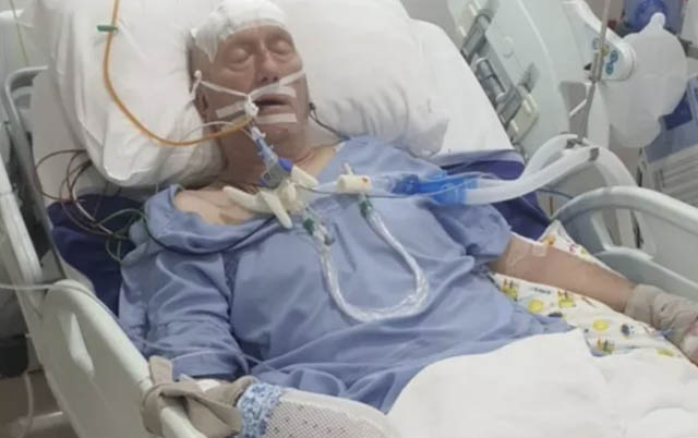 a man in hospital with a ventilator and other medical kit