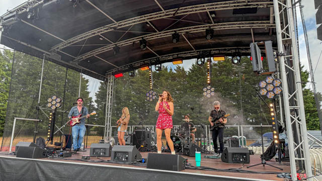 a four piece band, two men and two women on stage