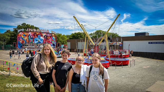 four girls by a fairground
