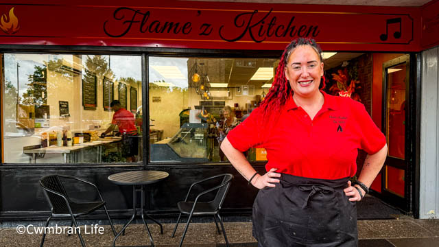 Rhiannon Maving outside her new business Flame'z Kitchen in Llanyrafon