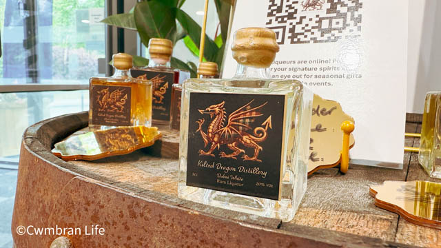 a bottle of spirits with a dragon on its label