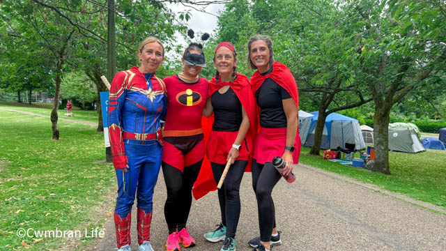 four people in superhero fancy dress