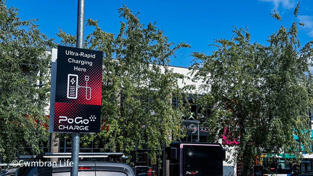 a sign for a PoGo Charge charging bays