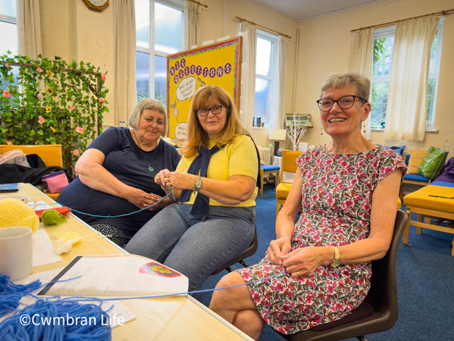 three women crocheting