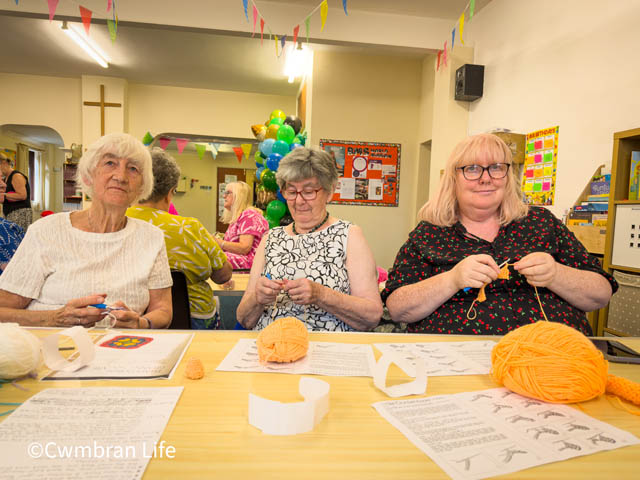 three women crocheting