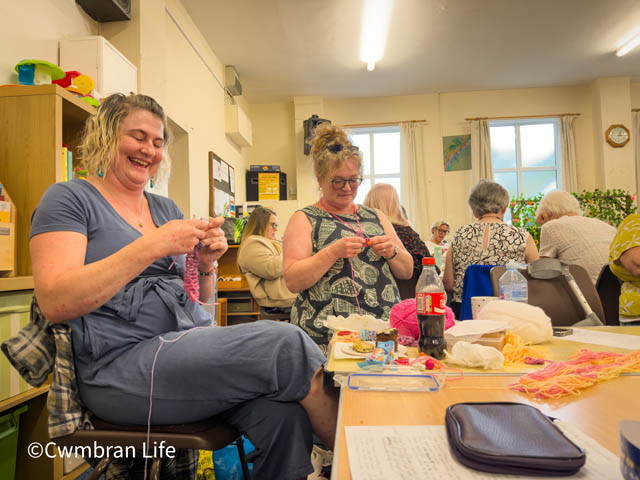 Two women crocheting