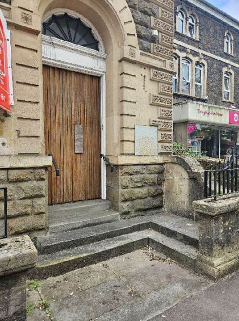 the doorway of a former bank