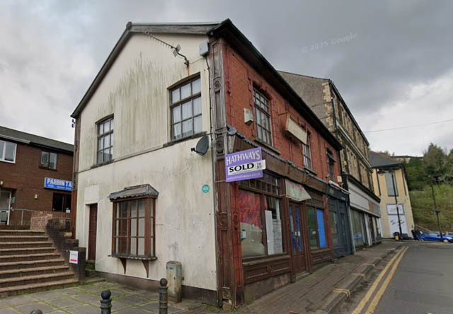 a row of shops in a town centre