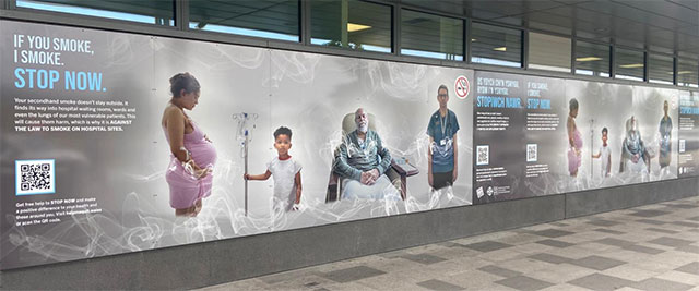 banner boards with text and image to discourage illegal smoking