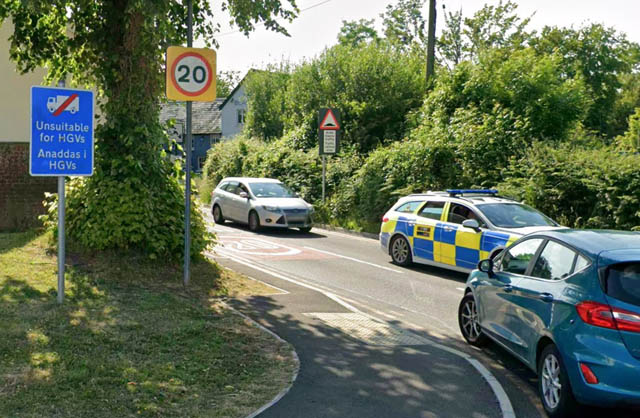 a road with several cars on it