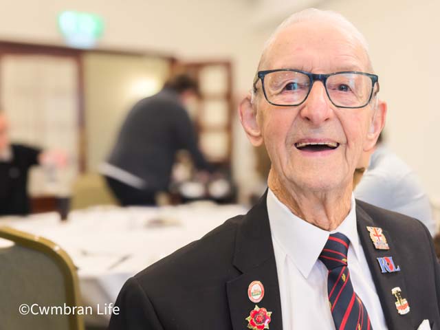 a man aged 106 smiles at the camera