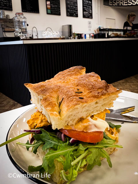 a sandwich on a plate in a cafe