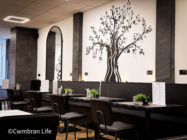 empty tables and chairs in a cafe