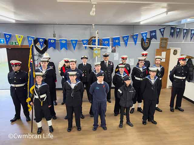 rows of sea cadets pose for a photo