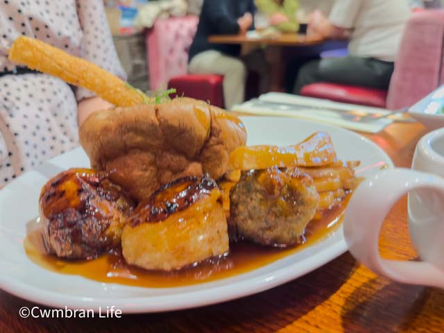 a beef dinner with potatoes covered in gravy