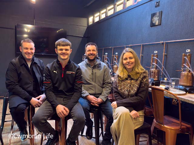(Left to right) Jamie Boycott, Caleb, Ian McDuff, and Marie Boycott in the events room at Kilted Dragon Distillery