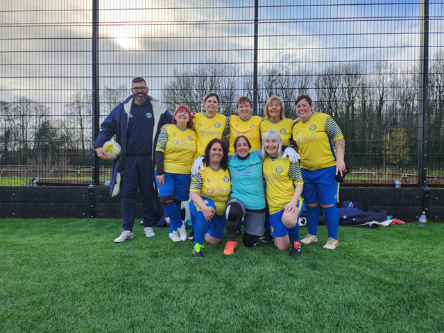 a women's football team have a team photo
