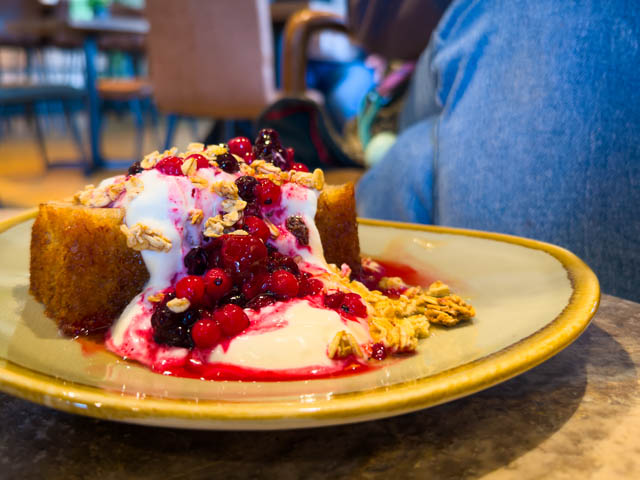 Banana Bread on a plate with yoghurt and berries