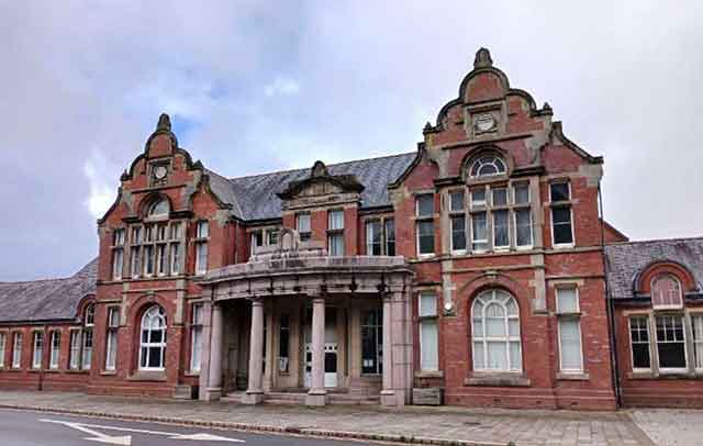 a large grand red brick building
