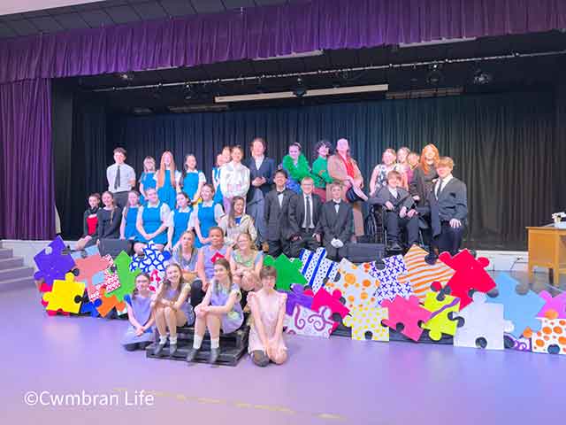 The cast of 'Annie – The Musical' at Cwmbran High School- all on stage in their costumes