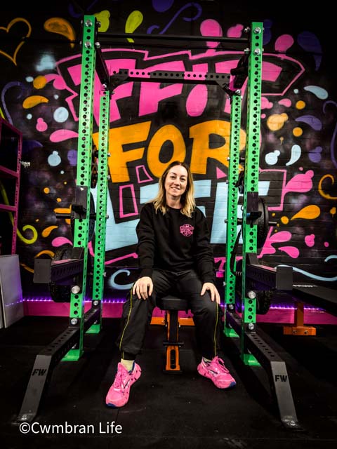 a woman sat on a weightlifting bench