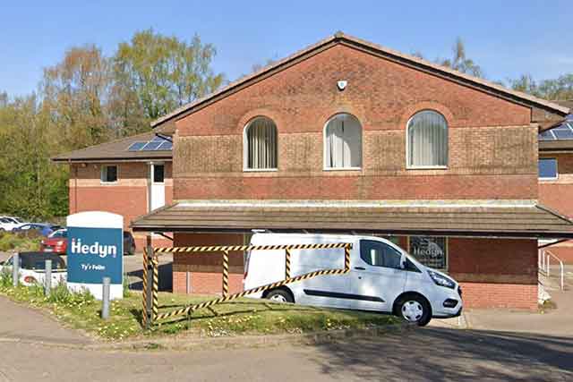 an office block with a white van outside it