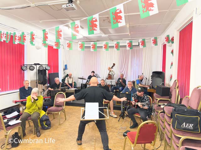 a group of musicians play together in a room