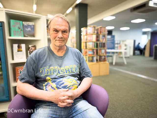 a man sat in a library
