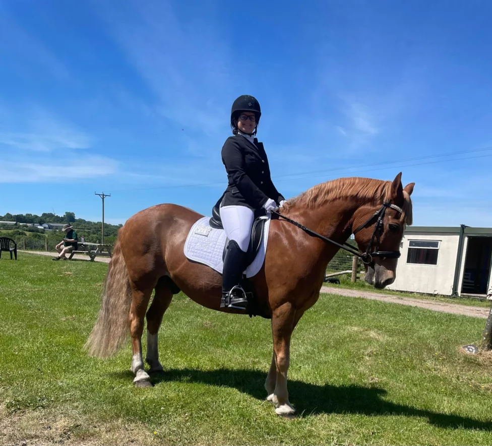 a woman sat on a horse