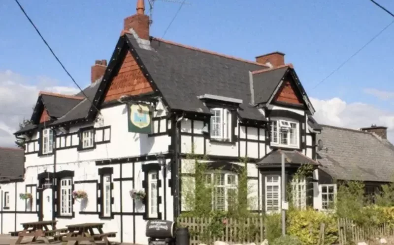 a pub next to a country lane