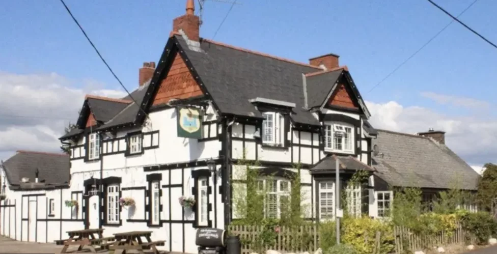 a pub next to a country lane