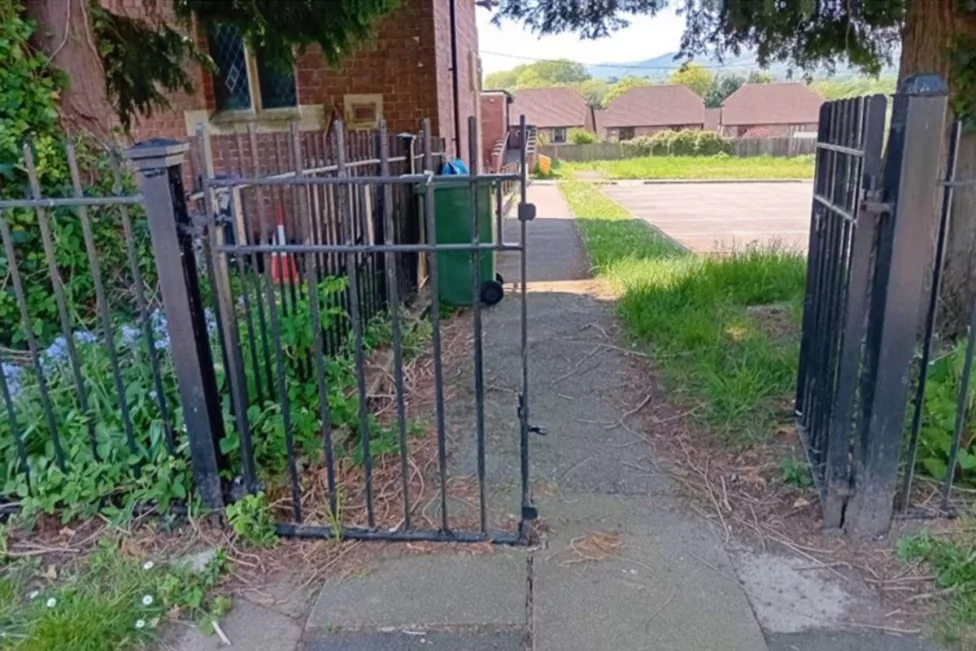 An entrance gate for a path leading to a church