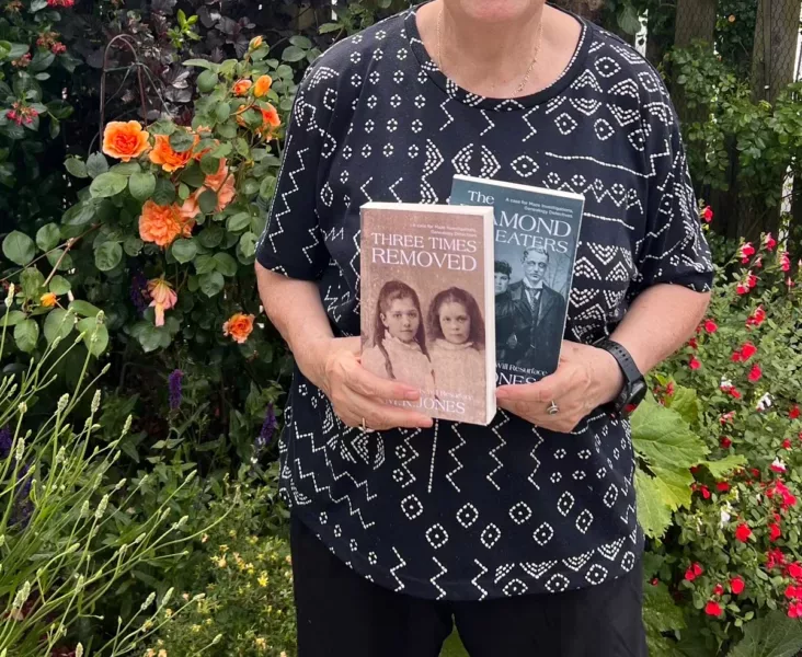 a woman holding up a book